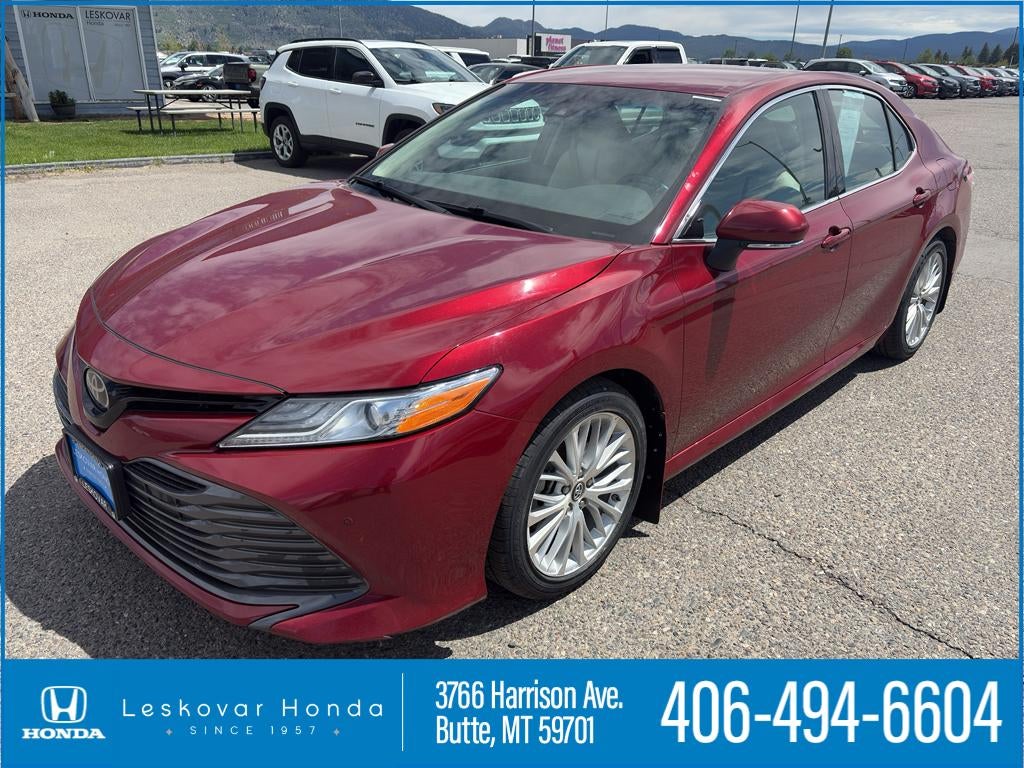 2018 Toyota Camry XLE in Ruby Flare Pearl — front three-quarter view
