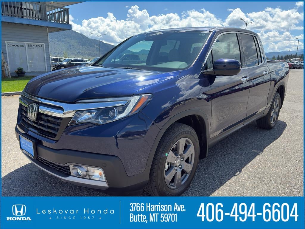 2020 Honda Ridgeline RTL-E in Obsidian Blue Pearl — front three-quarter view